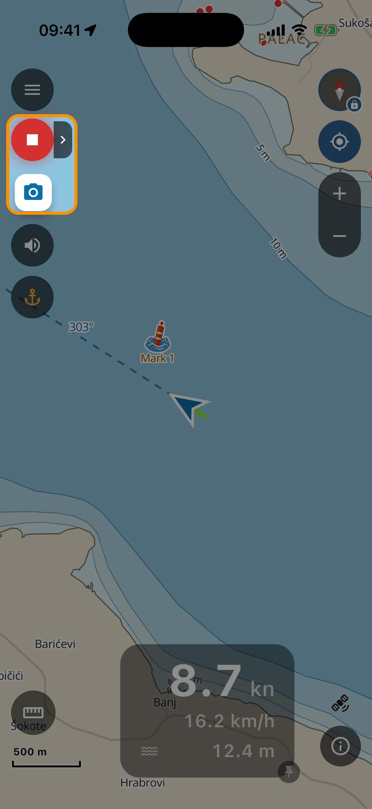 Boat under way with speed-coloured track and camera button